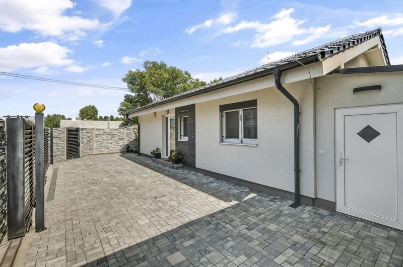 Front parking court and family house exterior